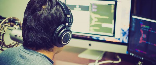 Canva - Selective Focus Photography of Man Facing Computer